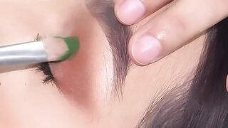Glitter green eye makeup..