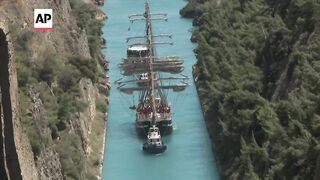 The Olympic flame crosses the Corinth canal en route to Marseille.