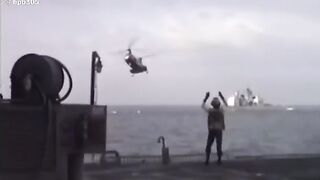 Military aircraft picks up cargo with insane speed and precision on carrier.