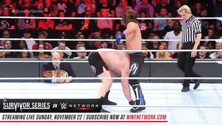 Brock Lesnar escapes AJ Styles' calf crusher by repeatedly smashing his head on the mat