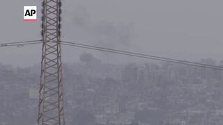 Loud explosions and plumes of smoke rising on the Gaza skyline.