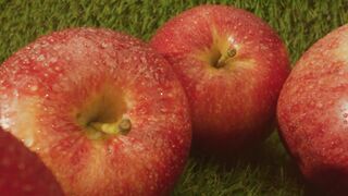 Fresh apples in a row on a natural background