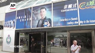 Transgender activist Henry Tse receives his new Hong Kong identity card.
