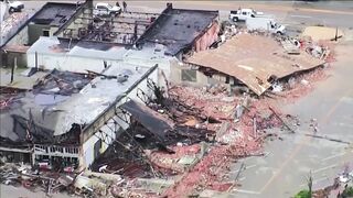 Buildings collapse after a tornado rips through Sulphur, Okla.