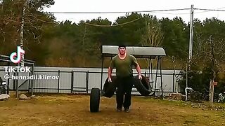 Dude casually juggling car tires