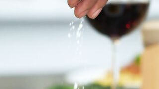 Serving Parmesan cheese in spaghetti bolognese close up engraving