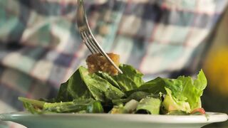 Person eating salad