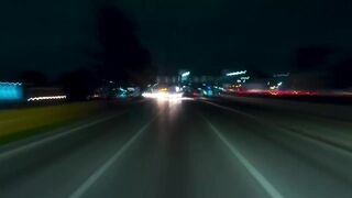 Timelapse of a drive through the city streets at night - adalinetv