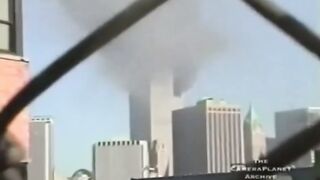 A woman records the moment the second plane hit the second tower on September 11th, 2001