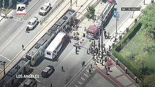 Metro train collides with bus in downtown Los Angeles, injuring more than 50.