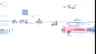 Thrill seeking Emiratis on jet skis swerve through Dubai's flooded roads after heavy rains sink cars
