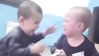 Funny baby fight with together