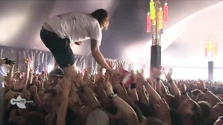 Singer catches beer while crowdwalking, and drinks it