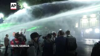 Police in Georgia use tear gas, water cannons to disperse protest against so-called 'Russian law'.