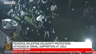 Pro-Israeli thugs assault the students peacefully camping for Gaza at UCLA in Los Angeles.