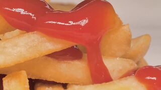 Texture of french fries with ketchup, macro close up