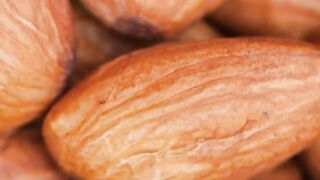 Piled almonds rotating detailed views