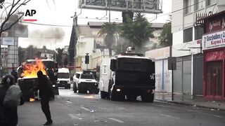 Police in Chile use water cannons to disperse May Day march protesters.