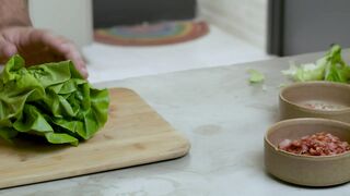 Chef chopping a lettuce