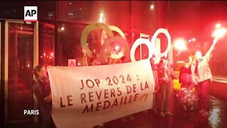 Protesters concerned about impact of Olympics on Paris rally in city.