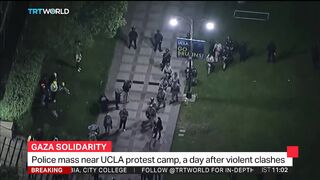Police mass near UCLA protest camp, a day after violent clashes