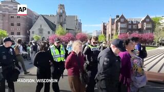 Police tear down tents and arrest protesters at University of Wisconsin.