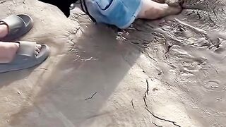 The girl is deeply trapped in quicksand, and her father and sister are rushing to rescue her