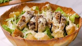 Chicken Caesar salad in a flatbread bowl