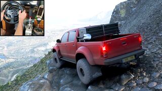 A Freeride in the 2007 Toyota Hilux AT38 offroading and climbing the Volcano Mount , in Forza Horizon 5, using Thrustmaster