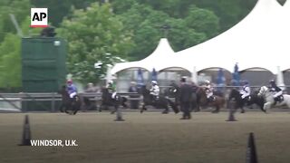 Young jockeys compete on Shetland ponies at Royal Windsor Horse Show.