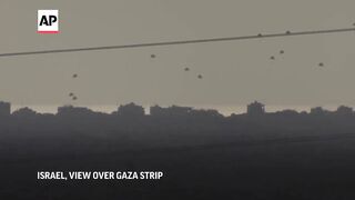Aid drops into Gaza and smoke seen from direction of Rafah.