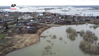 River Ishim in Russia rises to new record level, flooding another village.