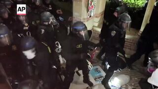 Police and protesters clash at UCLA in tense scene as pro-Palestinian encampment is dismantled.