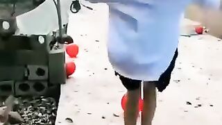 Prank done with this girl blowing up balloons