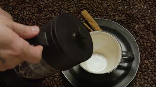 Man pouring coffee into a cup