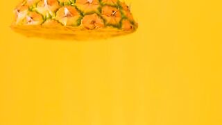 Pineapple sliced on a yellow background