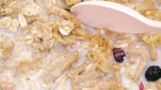Spoonful of healthy cereal with milk