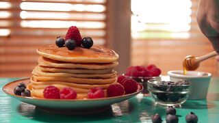 cakes with blackberries on a table for breakfast