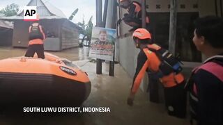 Floods and landslide kill 14 in Indonesia's Sulawesi island.