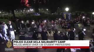 California University protests_ Police surround group of demonstrators.