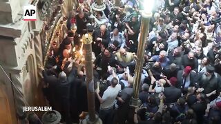Eastern Orthodox worshippers throng Holy Fire ceremony in Jerusalem.