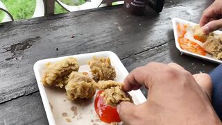 Beautiful girl eating fried tofu