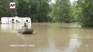 Texans are rescued from flood waters.