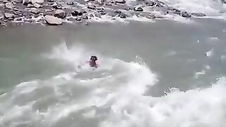 This boy will swim in the river and come to the shore or not