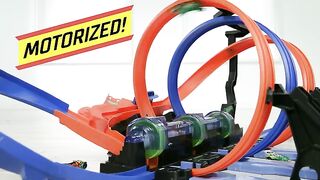 Hot Wheels Track Set and Toy Car, Large-Scale Motorized Track with 3 Corkscrew Loops, 3 Crash Zones and Toy Storage​​