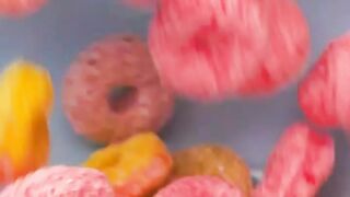 Filling a bowl with sugary ring cereal