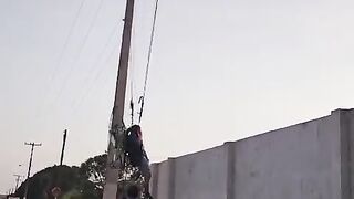 Man hangs on deadline high tension