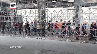 Desperate Palestinians line up for bread in Gaza City amid famine warning.