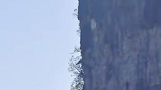The man jumped from the top of the mountain
