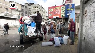 People prepare to leave after Israeli military orders evacuation of parts of Rafah